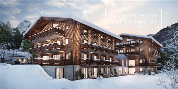 A modern wooden chalet with multiple balconies in a snow-covered mountain landscape. The architecture exudes tranquility and luxury.