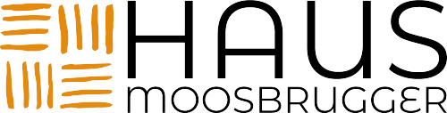 The image shows the logo of "Haus Moosbrugger". It consists of the lettering and a graphic element in orange and black.