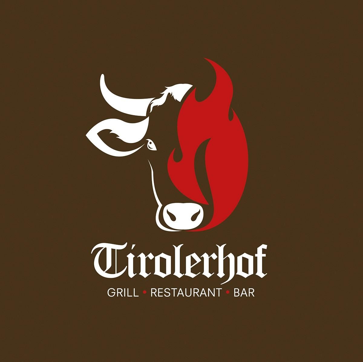 A logo with a cow's head and flames. Below is the inscription "Tirolerhof Grill Restaurant Bar".